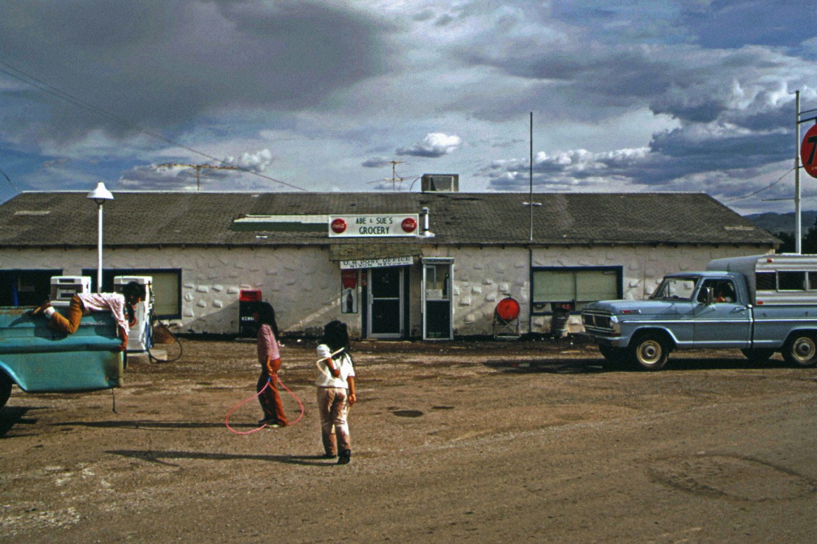 a couple of people that are standing in the dirt